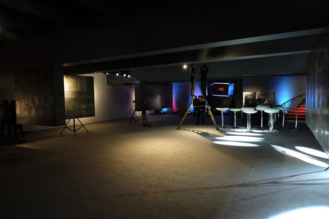 Retro television studio with bright stage lights and cameras