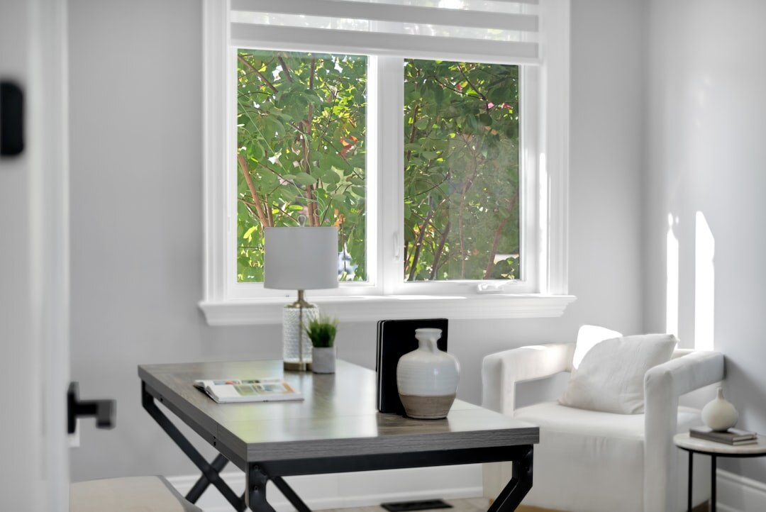 Bright modern editorial office with desks and large windows
