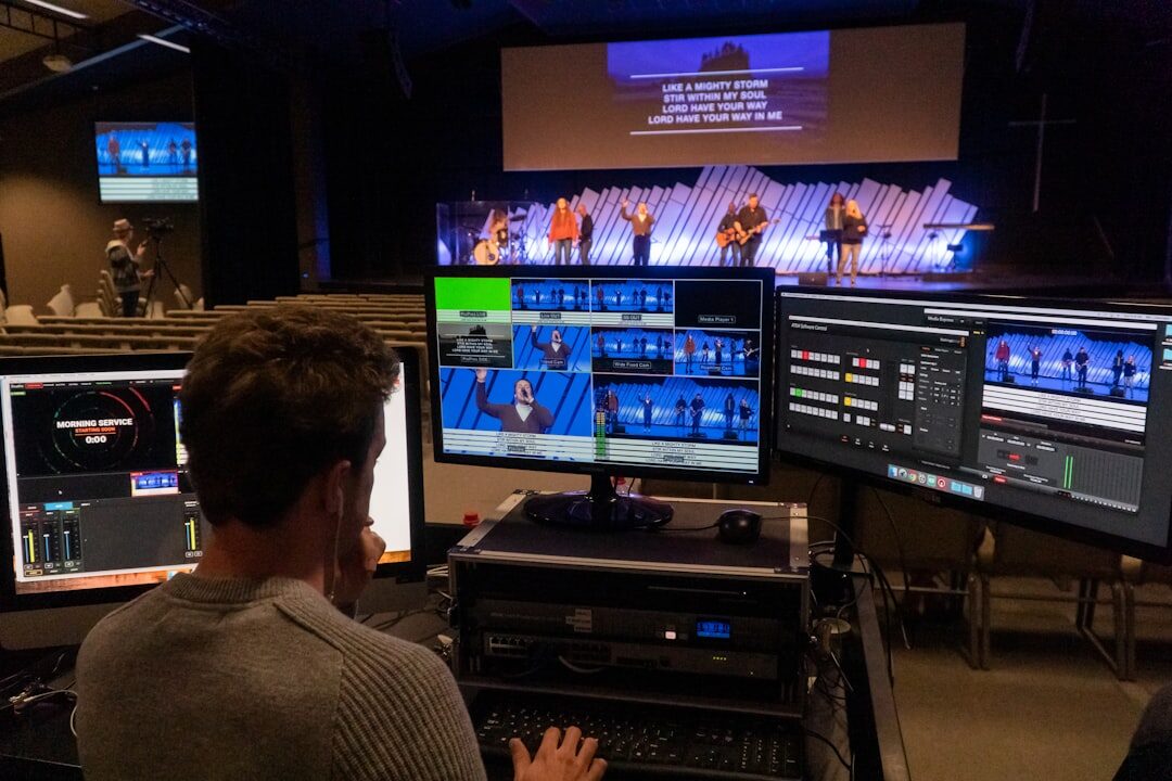 Video editing suite with multiple monitors showing footage